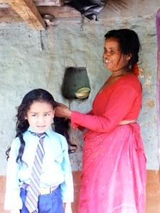Nepali mom braids her daughter's hair before school