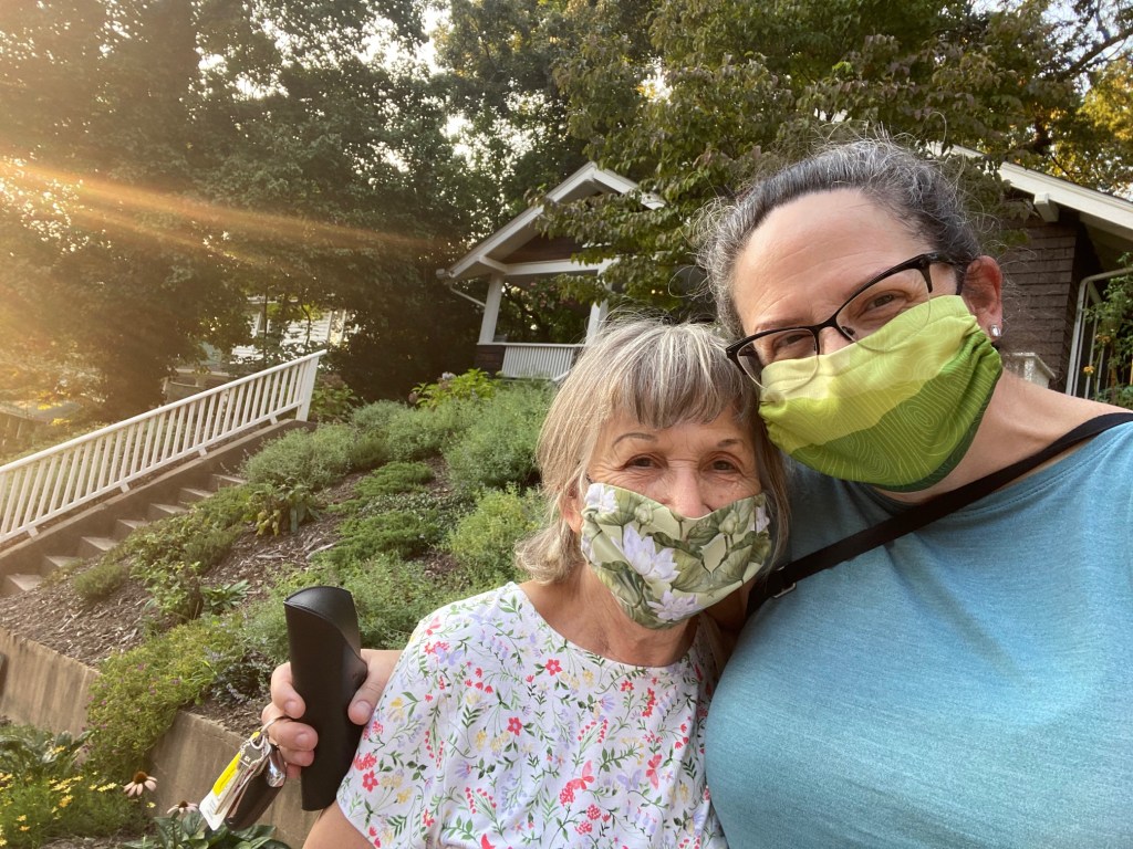 Mom and I, masked up, outside my house, on her birthday.