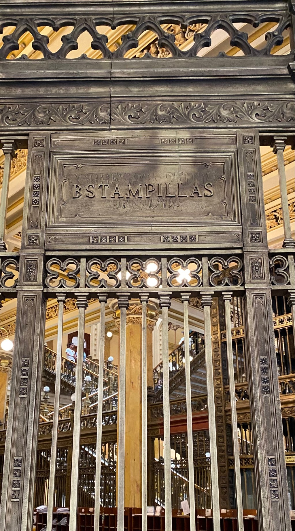 Picture of a turn of the century teller window to buy postal stamps